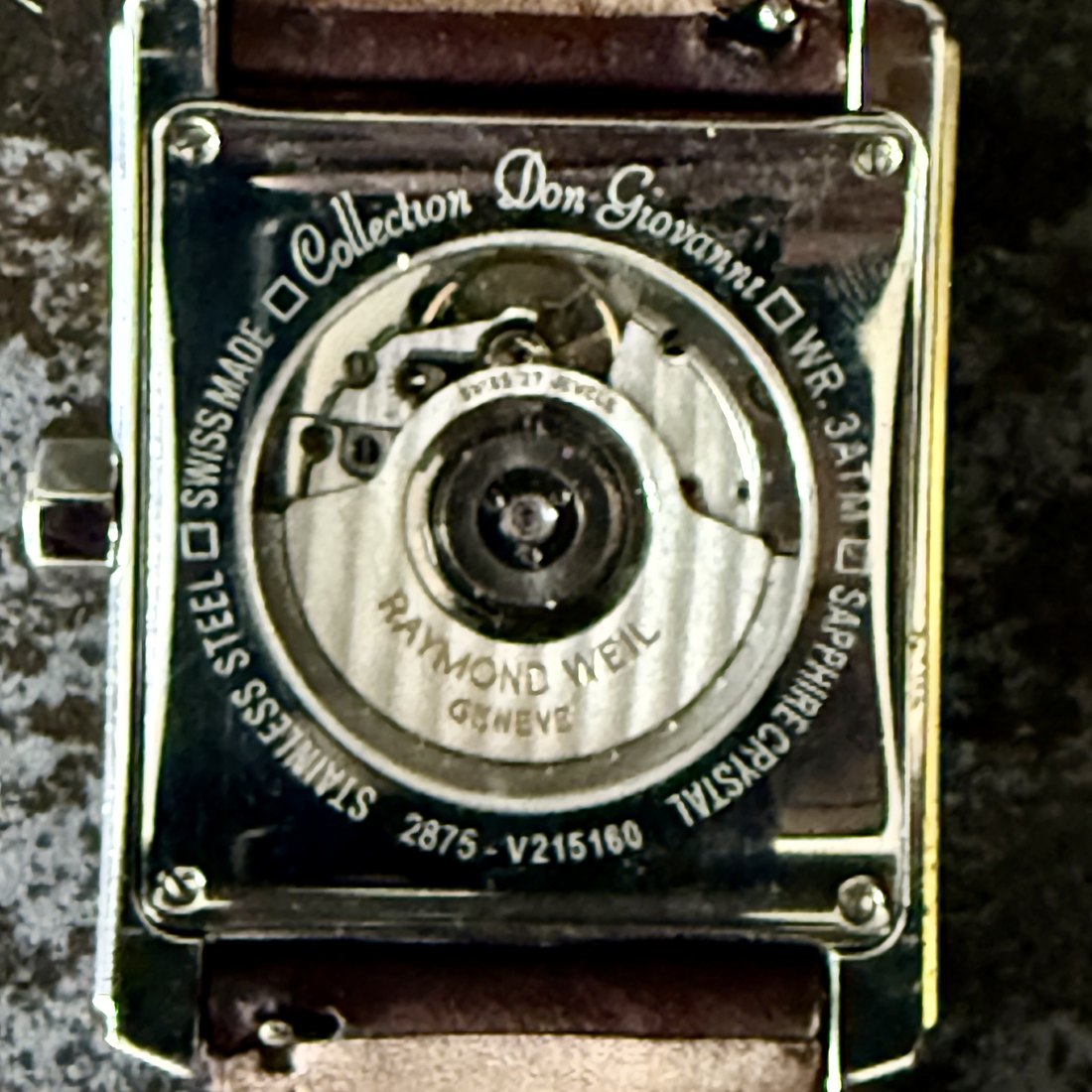 Raymond Weil Don Giovanni case-back: Collection Don Giovanni, Swiss Made, Sapphire Crystal, Stainless Steel, WR 3ATM, Raymond Weil Genève, reference 2875, serial V215160. Skeleton caseback reveals automatic movement.